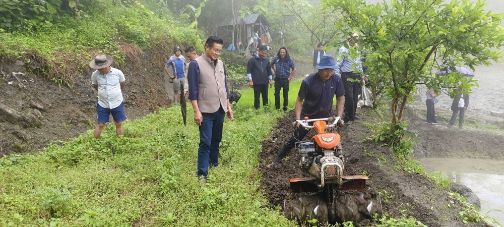 Advisor Mhathung Yanthan with others during the visit to Kigwema village on June 3.
